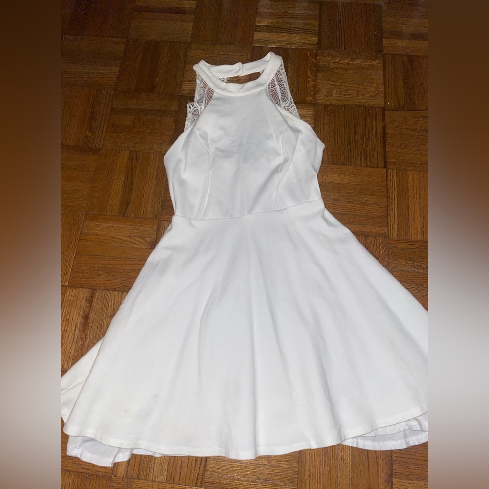 White cocktail dress with a high neckline.